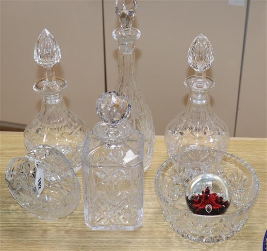 Four cut glass decanters, a Caithness paperweight, a bowl and a basket